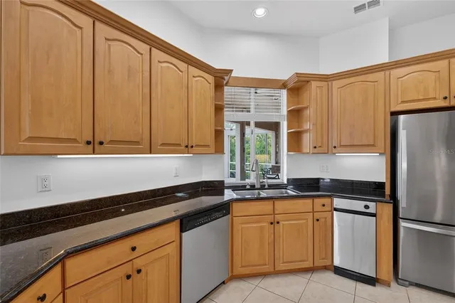 a bedroom with a bed and a night stand