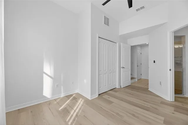 a bathroom with a sink double vanity granite tub shower and a mirror
