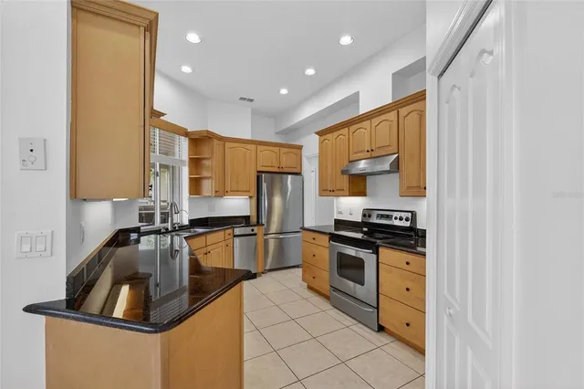 a bedroom with a bed and a view of bathroom