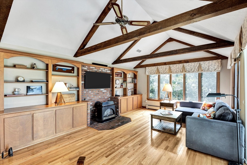 19 Babbling Brook Road Barnstable, MA 02632 - Photo 12 of 35 a living room with furniture a fireplace and a flat screen tv
