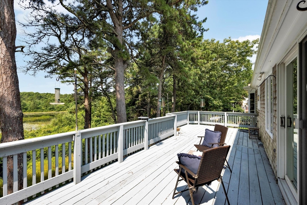 19 Babbling Brook Road Barnstable, MA 02632 - Photo 14 of 35 a view of a chairs and table on the wooden deck