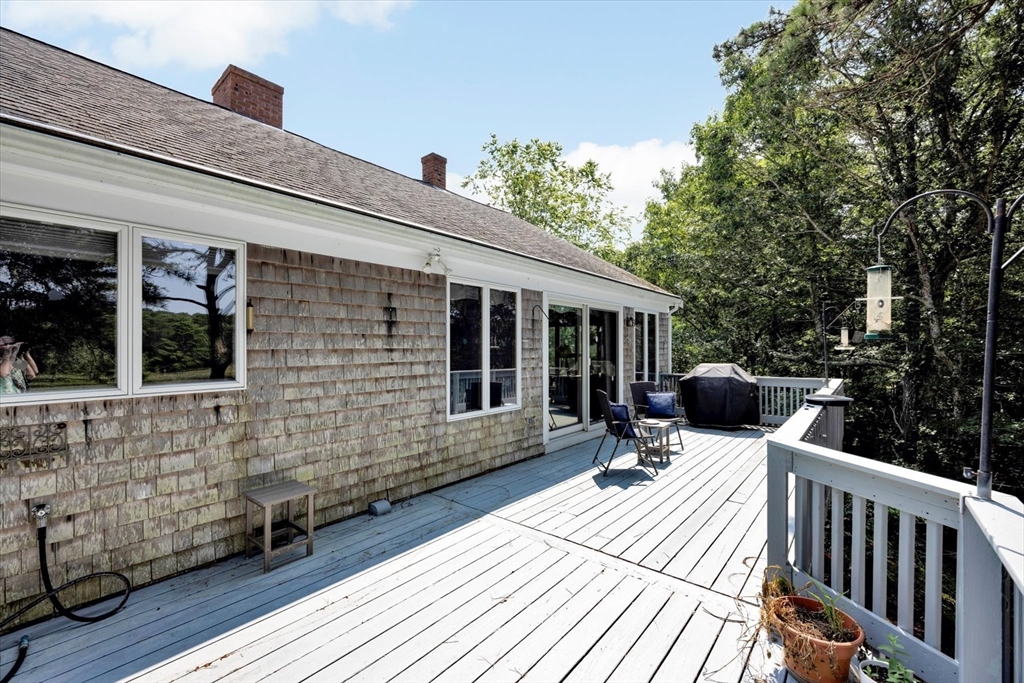 19 Babbling Brook Road Barnstable, MA 02632 - Photo 15 of 35 a view of house with deck outdoor seating