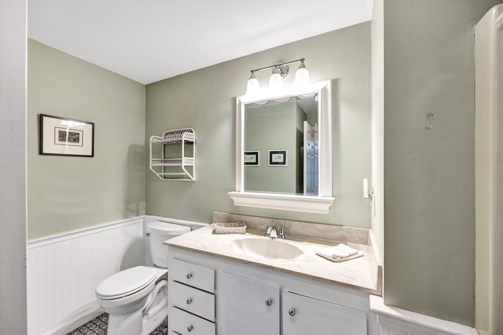 19 Babbling Brook Road Barnstable, MA 02632 - Photo 17 of 35 a bathroom with a toilet sink and mirror