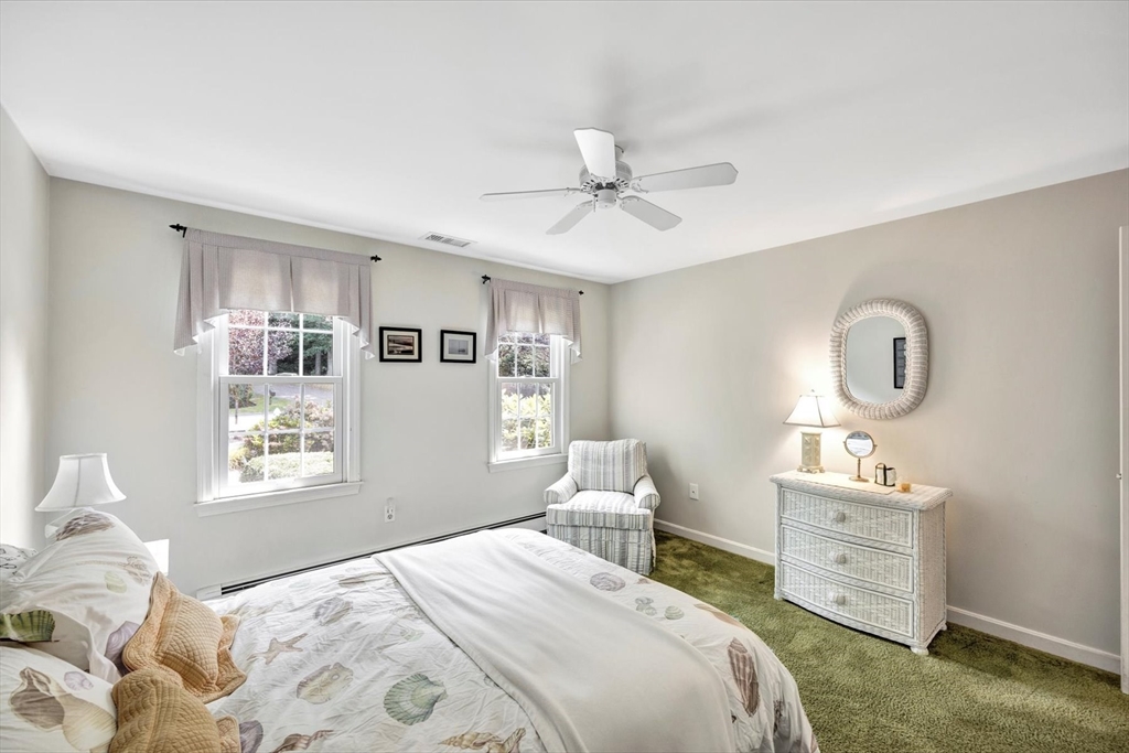 19 Babbling Brook Road Barnstable, MA 02632 - Photo 19 of 35 a bedroom with a bed and a window
