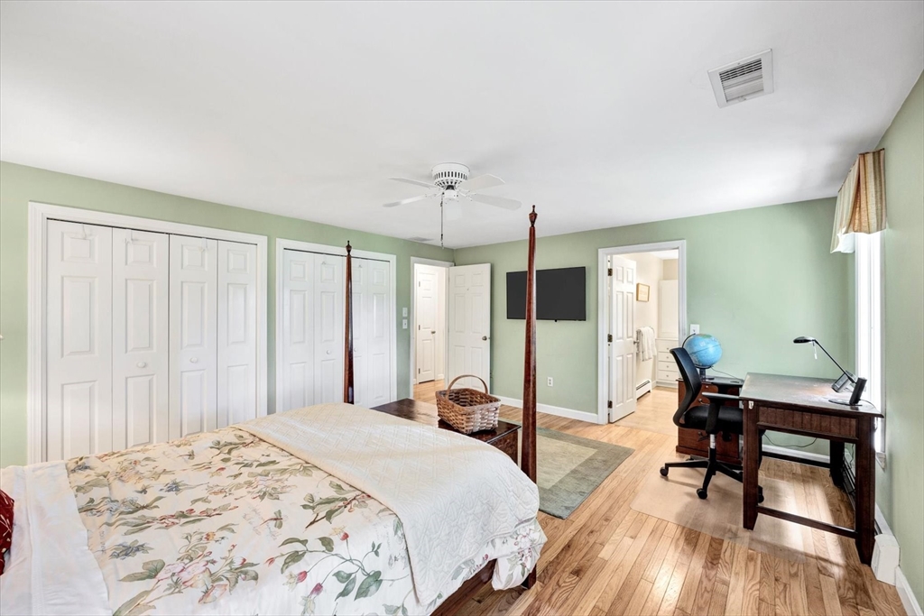 19 Babbling Brook Road Barnstable, MA 02632 - Photo 21 of 35 a bedroom with a bed and large windows