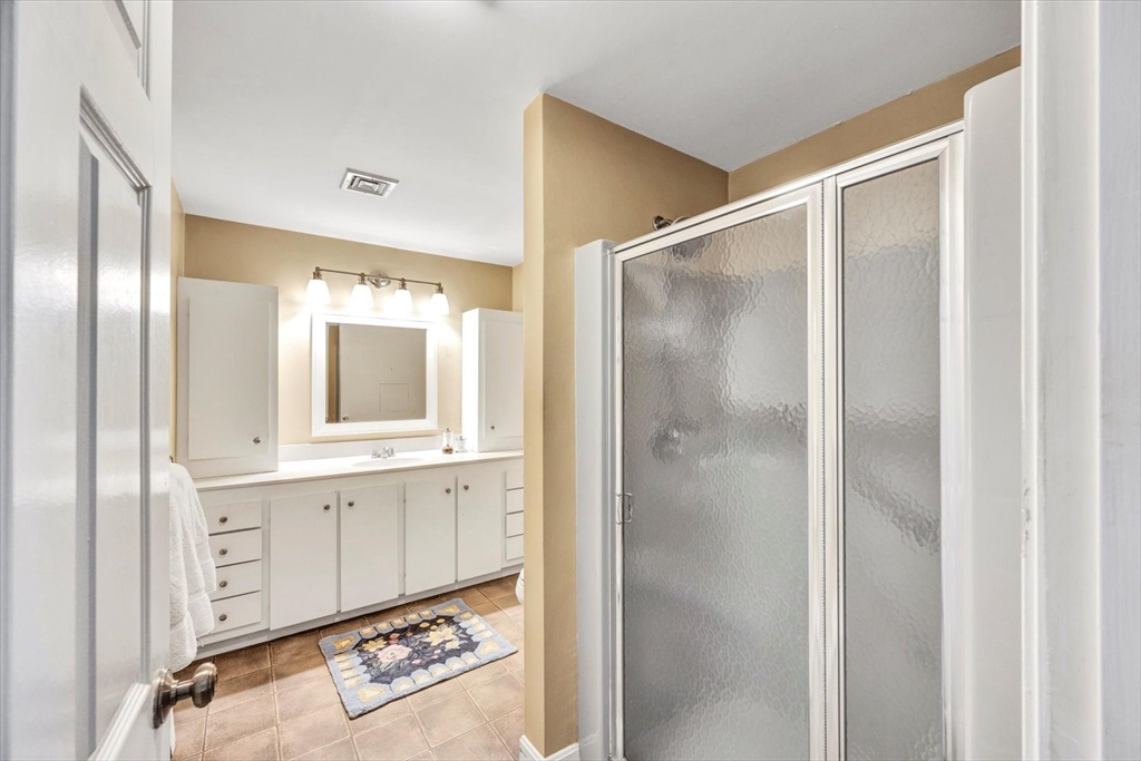 19 Babbling Brook Road Barnstable, MA 02632 - Photo 25 of 35 a bathroom with a shower and a mirror