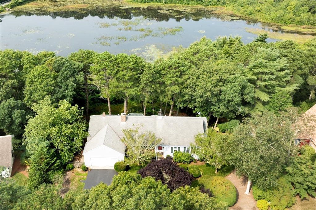 19 Babbling Brook Road Barnstable, MA 02632 - Photo 30 of 35 a view of a lake with a building in the background