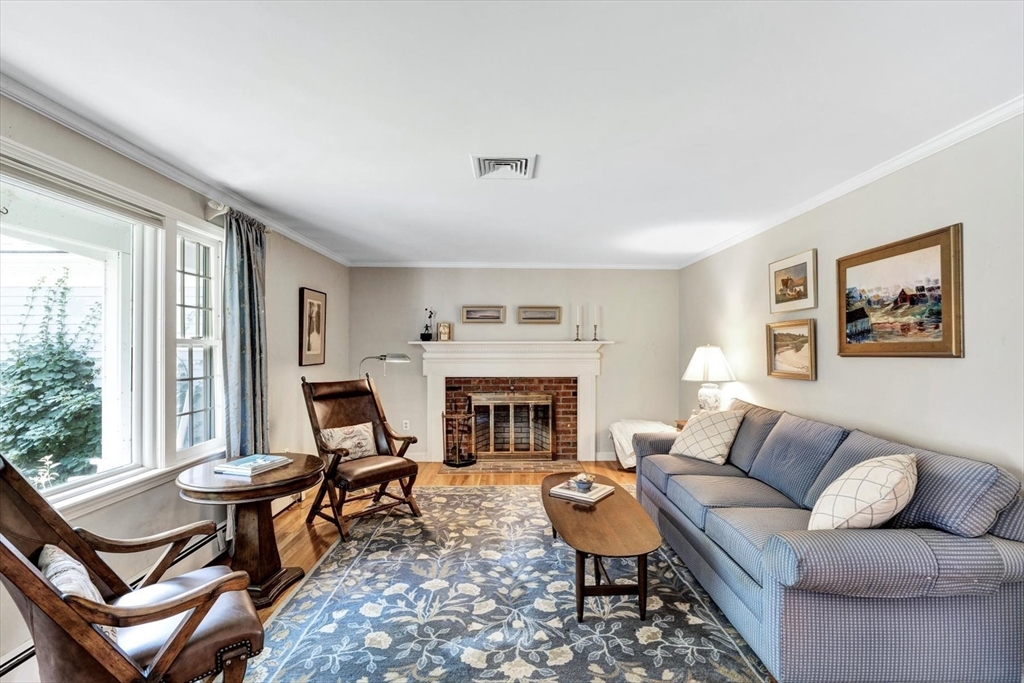 19 Babbling Brook Road Barnstable, MA 02632 - Photo 3 of 35 a living room with furniture and a fireplace