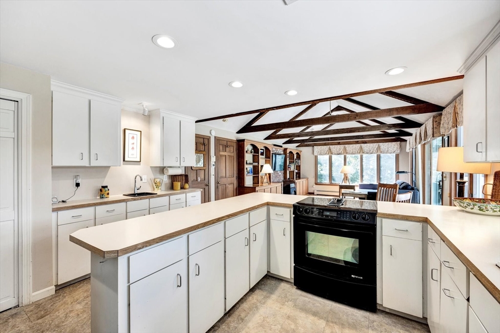 19 Babbling Brook Road Barnstable, MA 02632 - Photo 9 of 35 a kitchen that has a sink and a stove in it