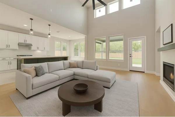a living room with furniture and a fireplace
