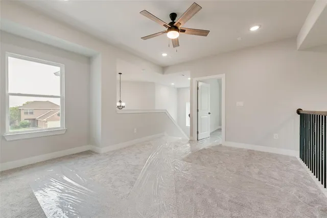 a view of an empty room and a window