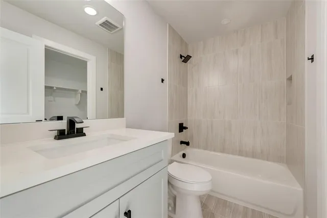 a bathroom with a sink a toilet and a bathtub