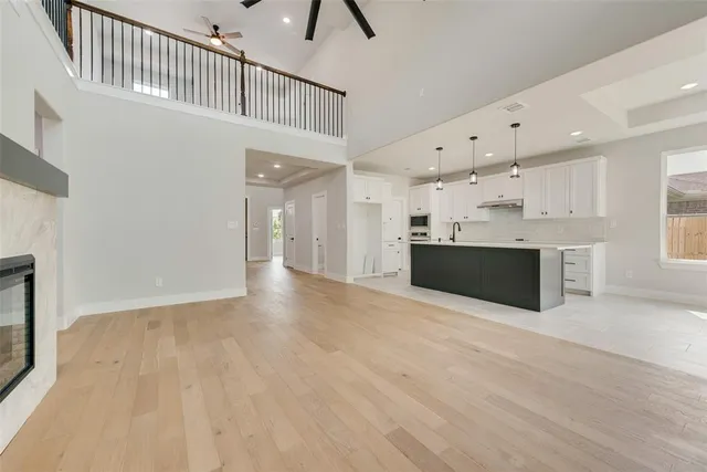 a view of kitchen with granite countertop cabinets and oven