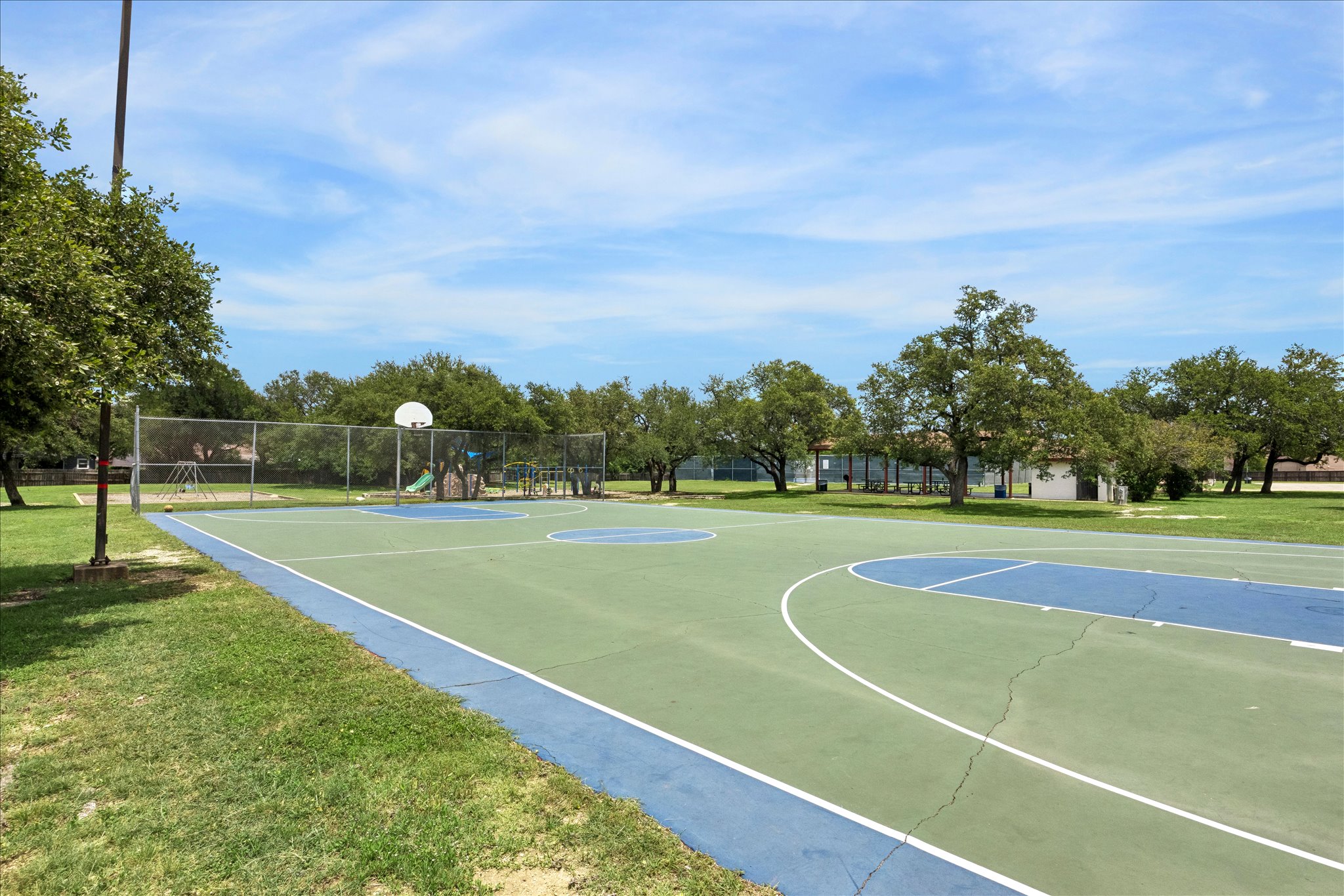 1306 Shady Grove Path Cedar Park, TX 78613 - Photo 40 of 40 a view of a playground and basketball court