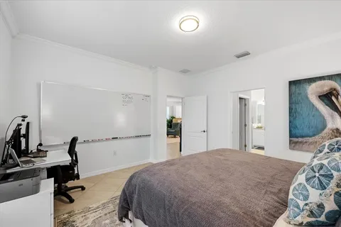 a spacious bathroom with a granite countertop sink a toilet and a mirror