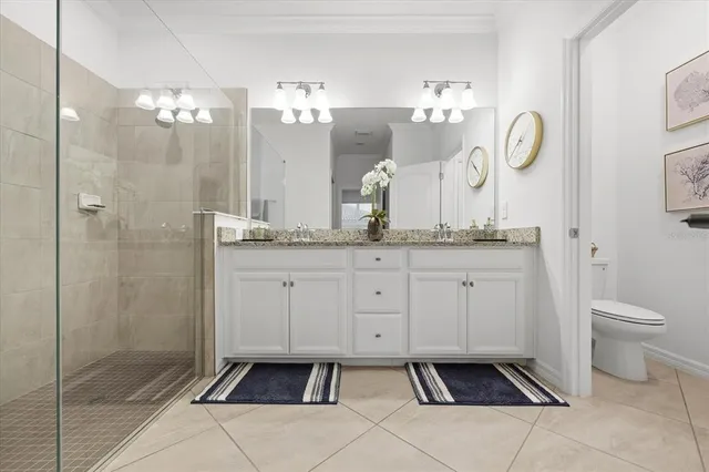 a living room with furniture a rug and a book shelf