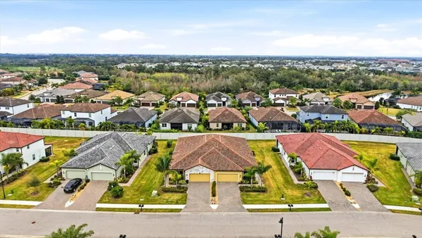an aerial view of residential building and lake view