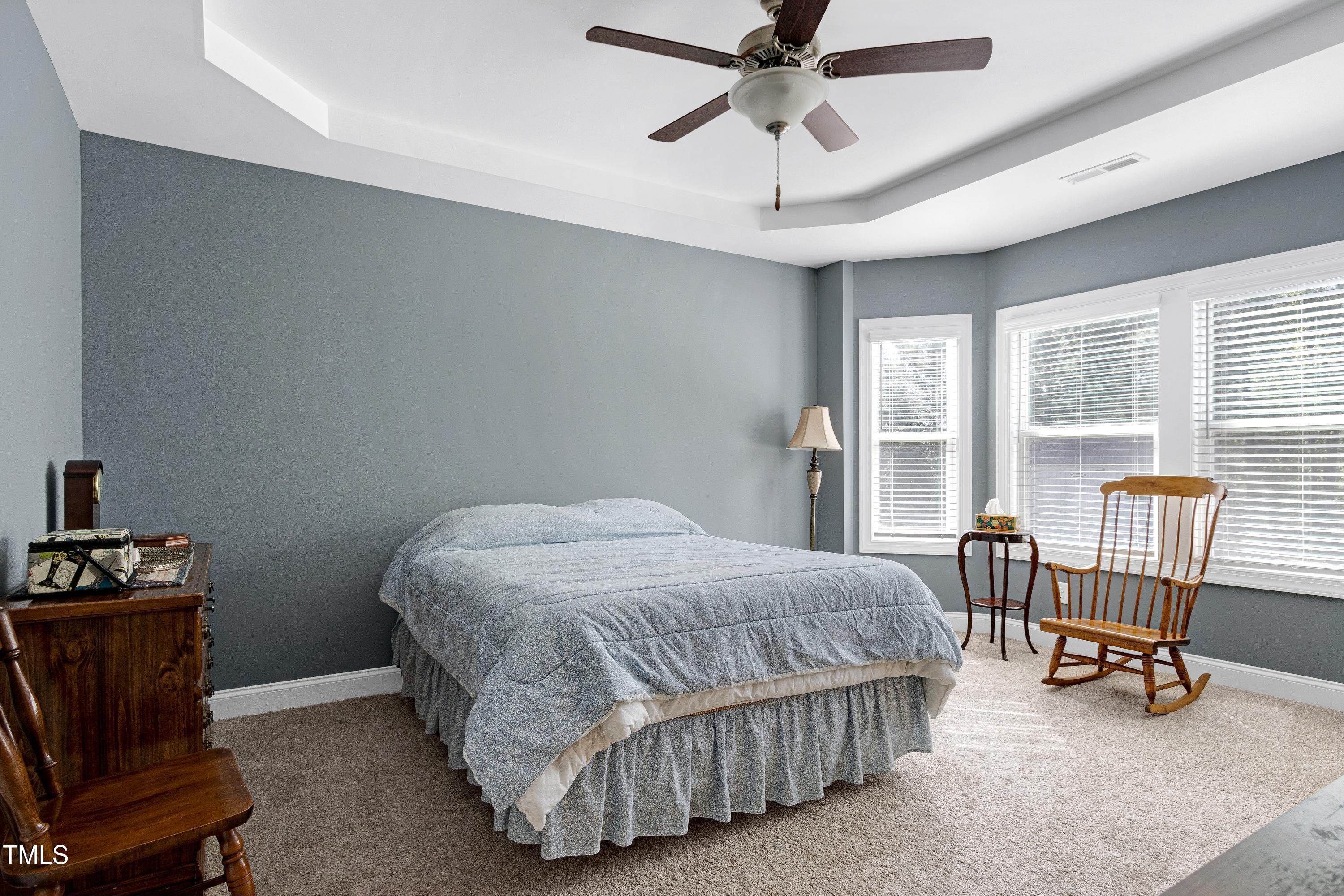 1613 Osprey Ridge Drive Willow Spring, NC 27592 - Photo 15 of 37 a bedroom with a bed chair and window