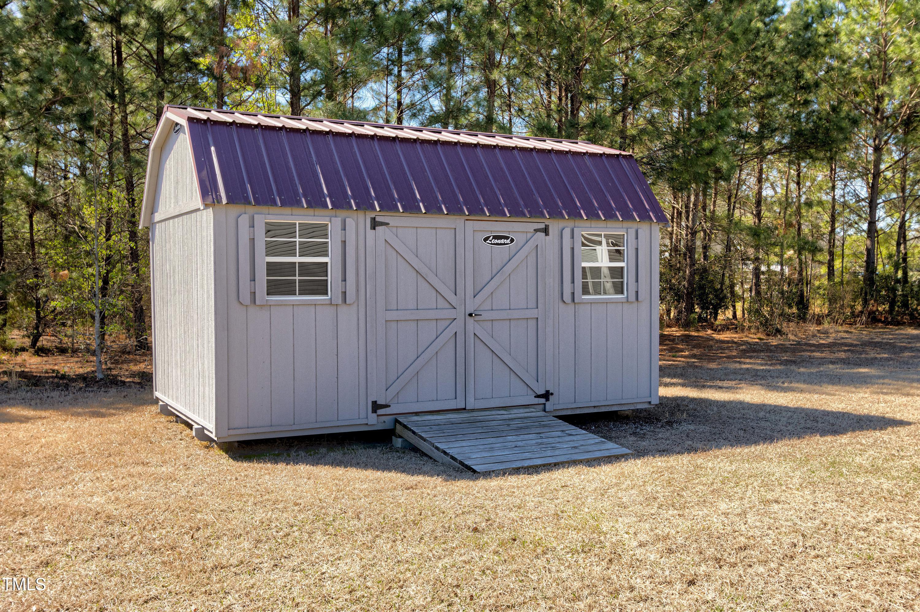 1613 Osprey Ridge Drive Willow Spring, NC 27592 - Photo 30 of 37 a view of a house with a yard