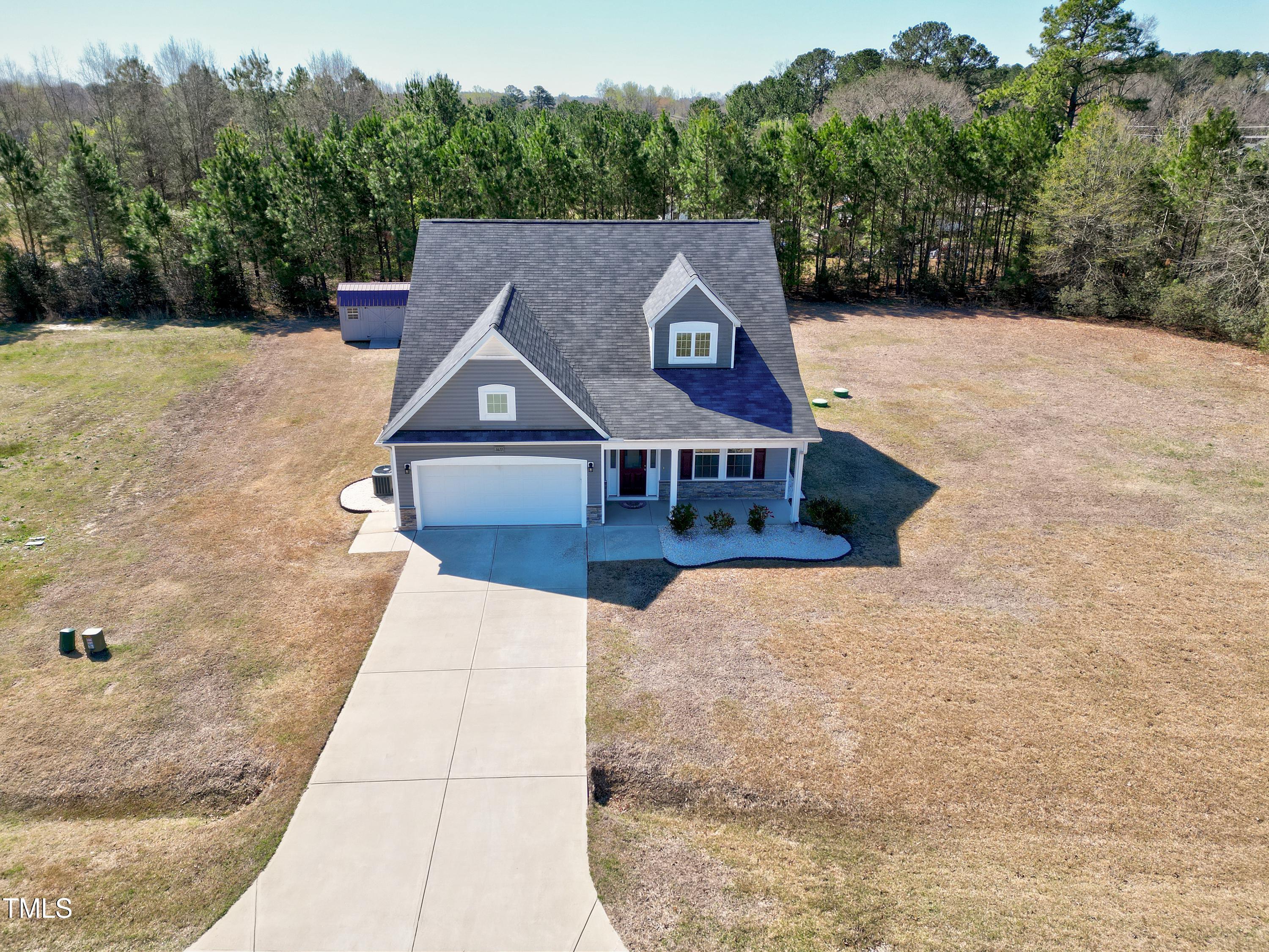 1613 Osprey Ridge Drive Willow Spring, NC 27592 - Photo 32 of 37 a aerial view of a house with a yard