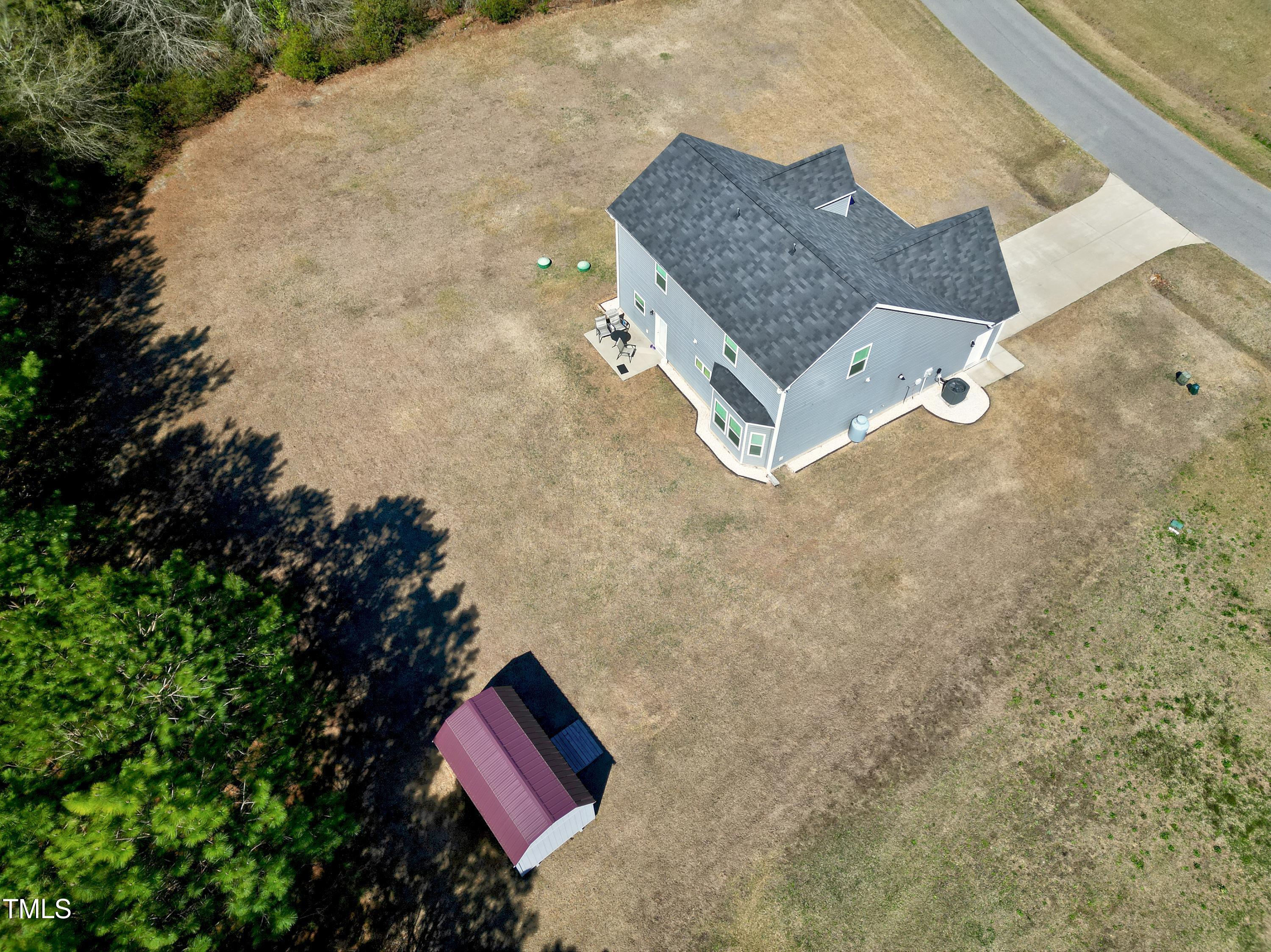 1613 Osprey Ridge Drive Willow Spring, NC 27592 - Photo 33 of 37 a aerial view of a house with a yard and wooden fence
