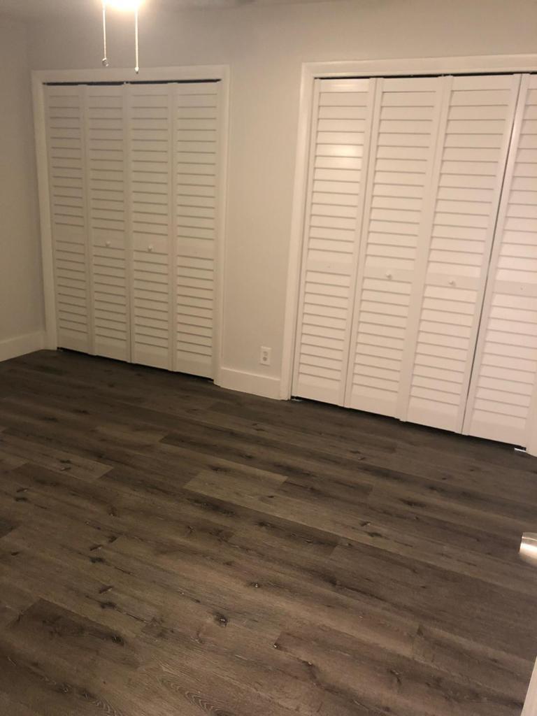 4115 Riverside Drive, Unit 15 Coral Springs, FL 33065 - Photo 17 of 33 an empty room with wooden floor