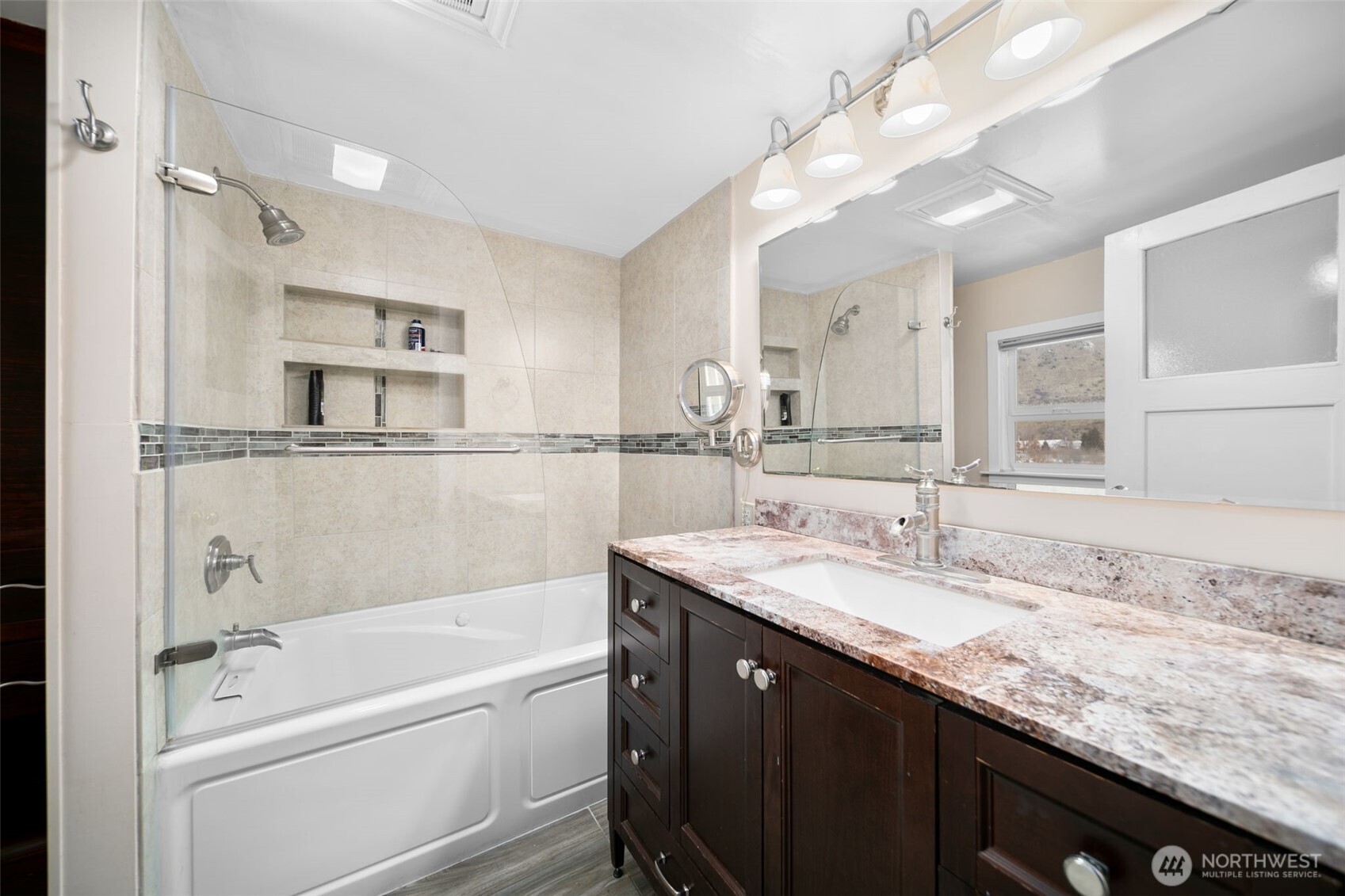 4693 Valley Street Monitor, WA 98836 - Photo 12 of 40 a bathroom with a granite countertop sink mirror and bathtub