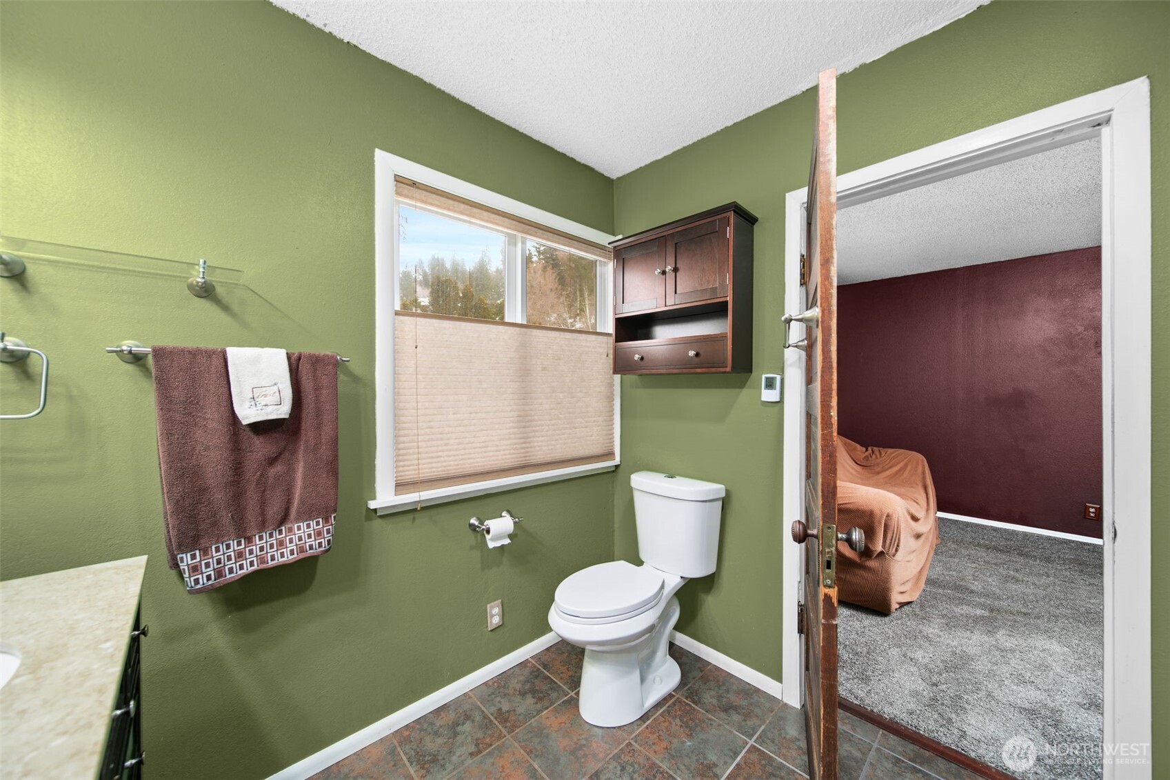 4693 Valley Street Monitor, WA 98836 - Photo 17 of 40 a bathroom with a toilet and a sink