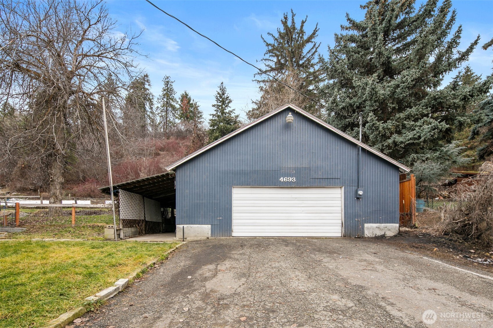 4693 Valley Street Monitor, WA 98836 - Photo 26 of 40 a view of a house with a yard and garage