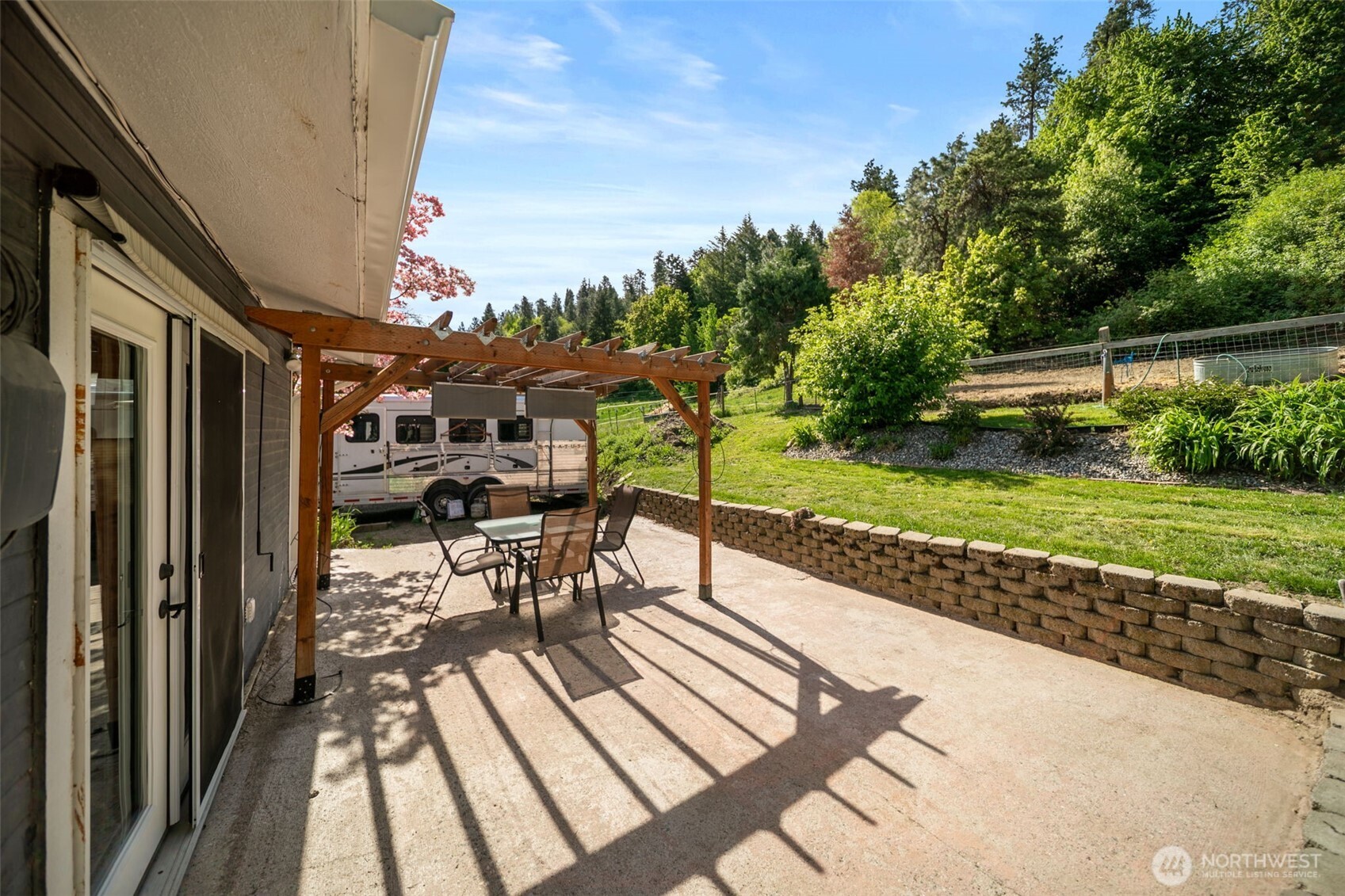 4693 Valley Street Monitor, WA 98836 - Photo 29 of 40 a view of a patio with table and chairs and potted plants