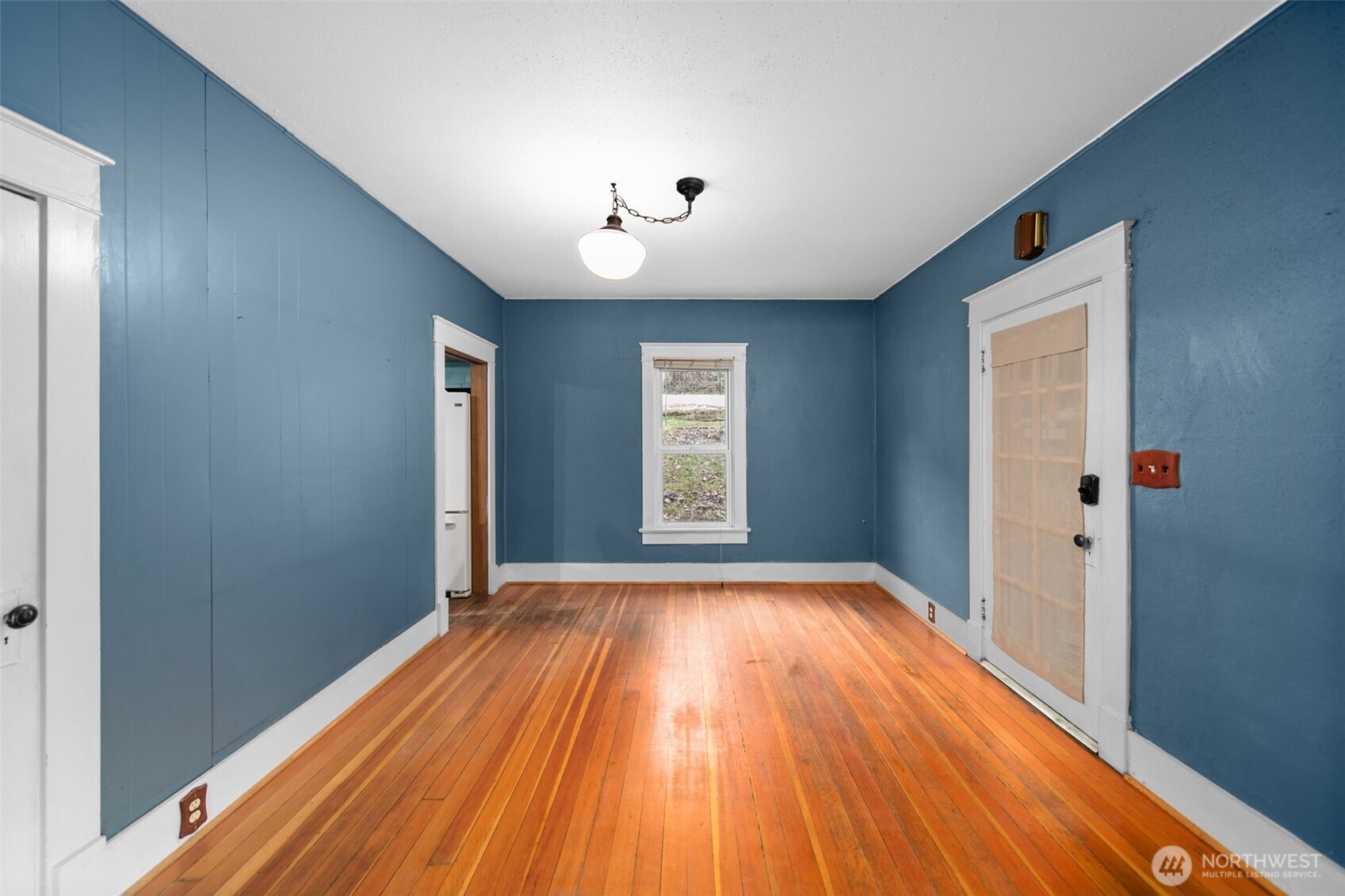 4693 Valley Street Monitor, WA 98836 - Photo 3 of 40 a view of an empty room with wooden floor and a window