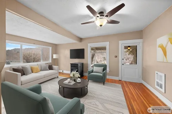 a living room with furniture and a large window