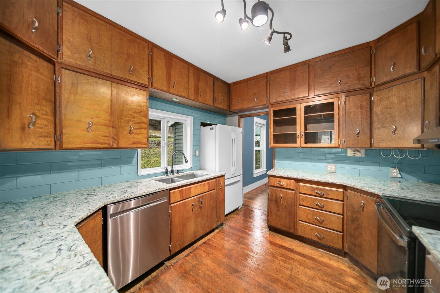 4693 Valley Street Monitor, WA 98836 - Photo 9 of 40 a kitchen with stainless steel appliances granite countertop a sink and a stove