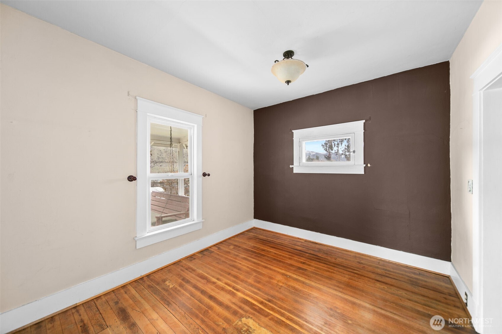 4693 Valley Street Monitor, WA 98836 - Photo 10 of 40 a view of an empty room with window and wooden floor