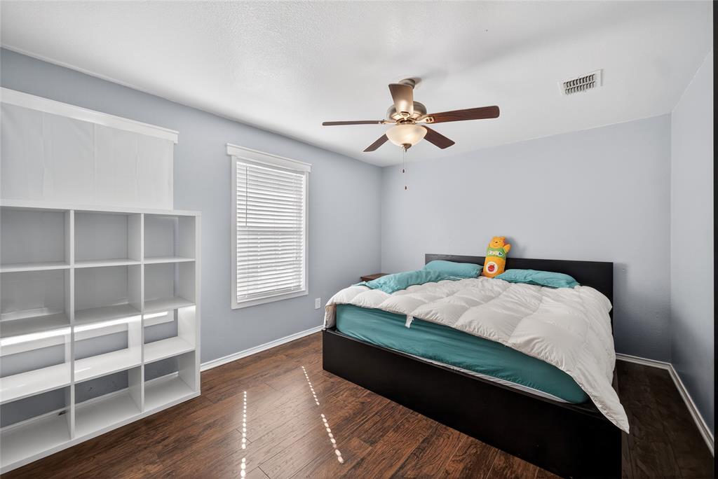 9633 Anns Way Plano, TX 75025 - Photo 24 of 37 a bedroom with a bed and a window