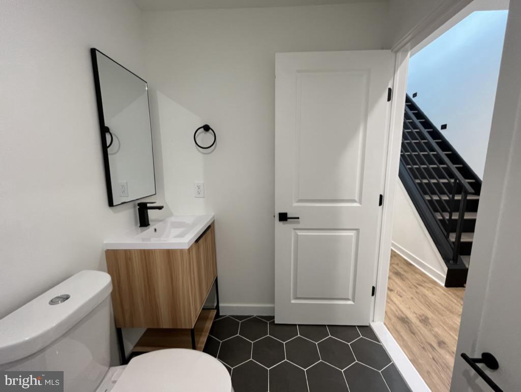 2117 North 8th Street Philadelphia, PA 19122 - Photo 11 of 17 a bathroom with a toilet and a mirror