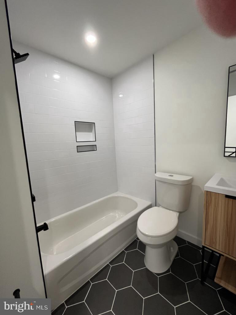 2117 North 8th Street Philadelphia, PA 19122 - Photo 14 of 17 a bathroom with a toilet and a shower