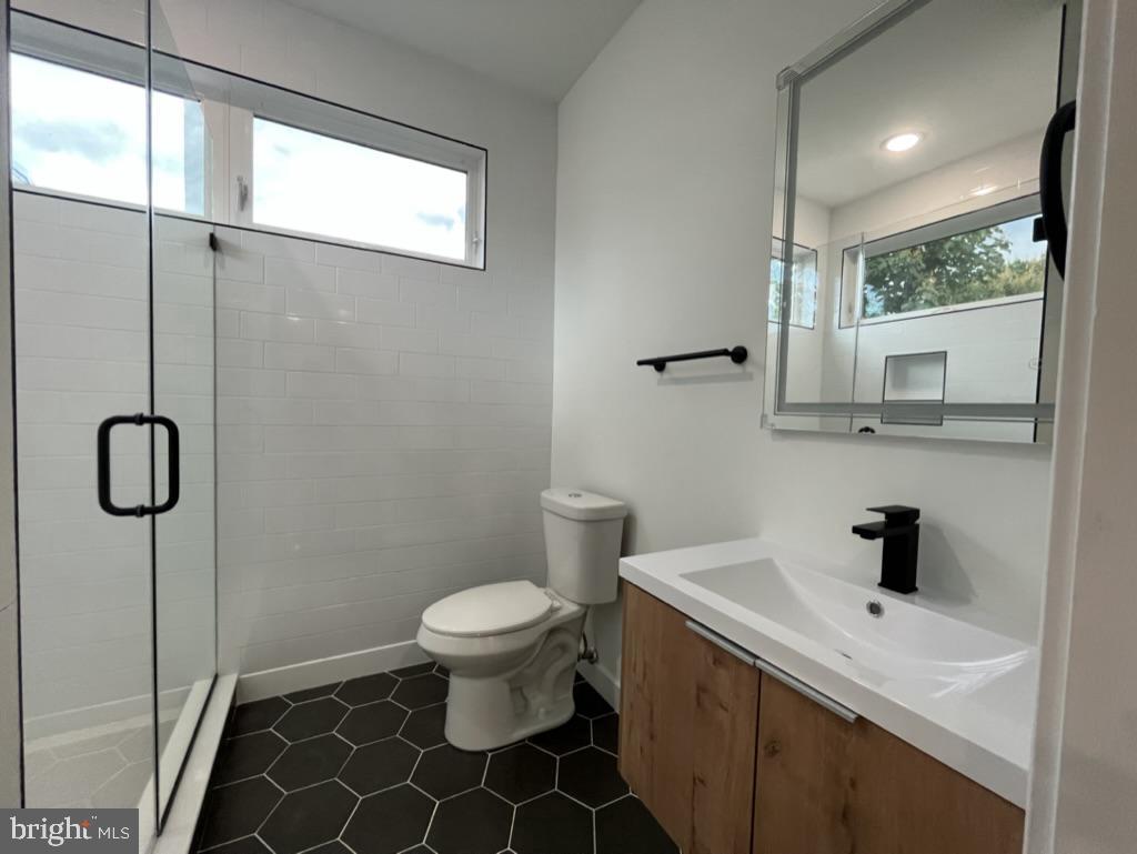 2117 North 8th Street Philadelphia, PA 19122 - Photo 4 of 17 a bathroom with a sink toilet and shower