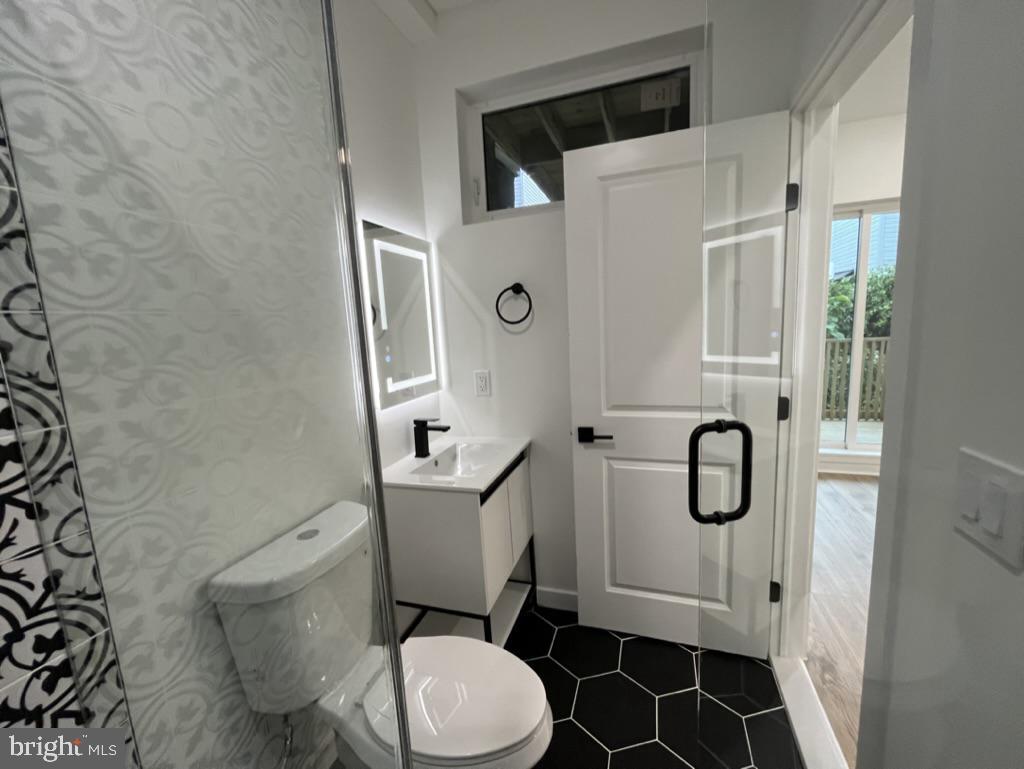 2117 North 8th Street Philadelphia, PA 19122 - Photo 7 of 17 a bathroom with a toilet sink and shower