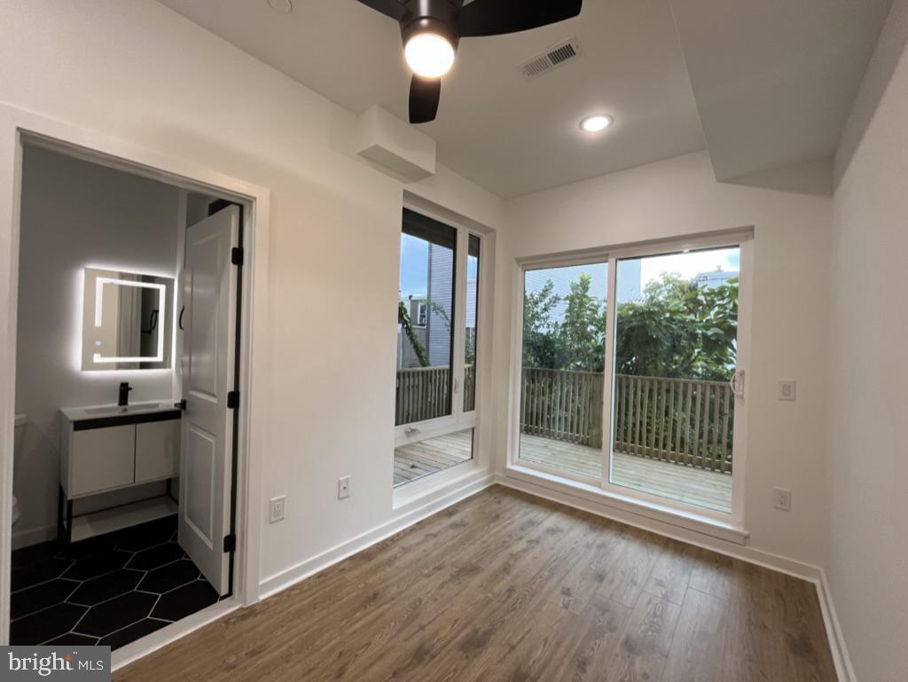 2117 North 8th Street Philadelphia, PA 19122 - Photo 8 of 17 a view of a hallway with wooden floor and cabinet