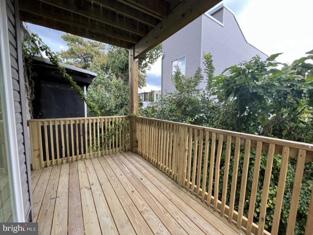 2117 North 8th Street Philadelphia, PA 19122 - Photo 9 of 17 a balcony with wooden floor
