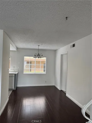 a kitchen with sink a stove and cabinets