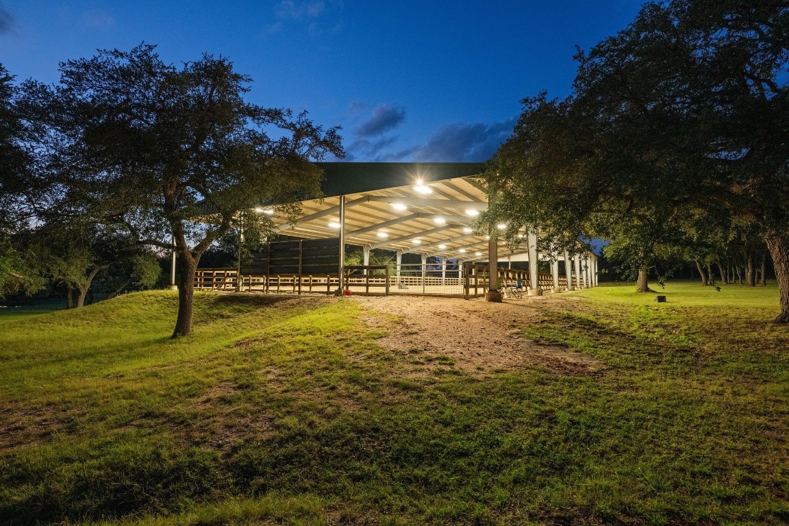 5200 Bell Springs Road Dripping Springs, TX 78620 - Photo 14 of 36 a view of a swimming pool with an outdoor space and seating area