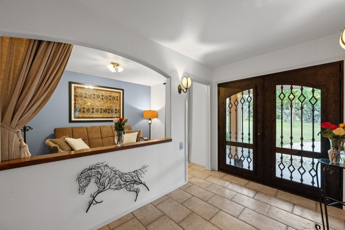 5200 Bell Springs Road Dripping Springs, TX 78620 - Photo 22 of 36 a living room with furniture and a large window