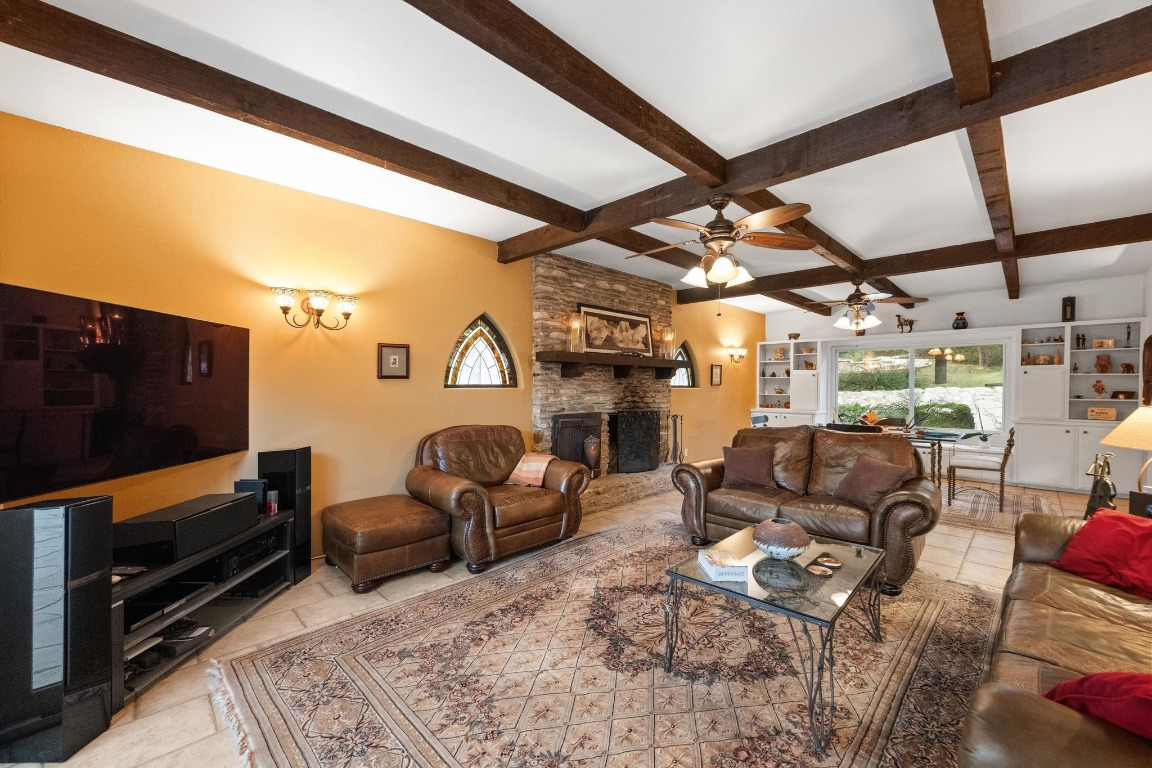 5200 Bell Springs Road Dripping Springs, TX 78620 - Photo 24 of 36 a living room with furniture a flat screen tv and kitchen view