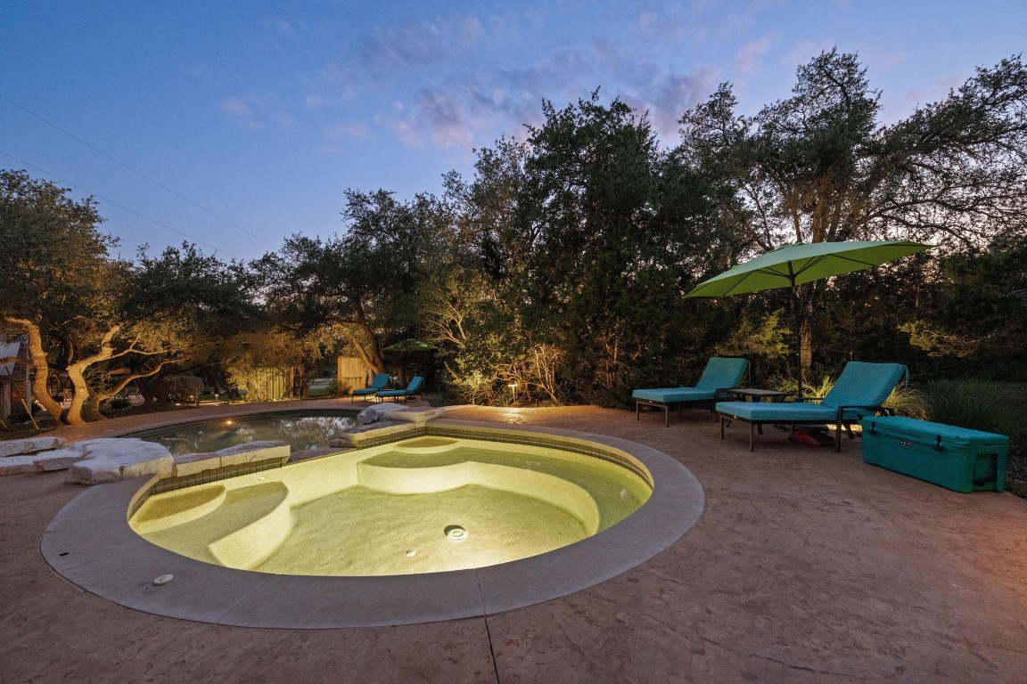 5200 Bell Springs Road Dripping Springs, TX 78620 - Photo 35 of 36 a view of a swimming pool and lounge chairs