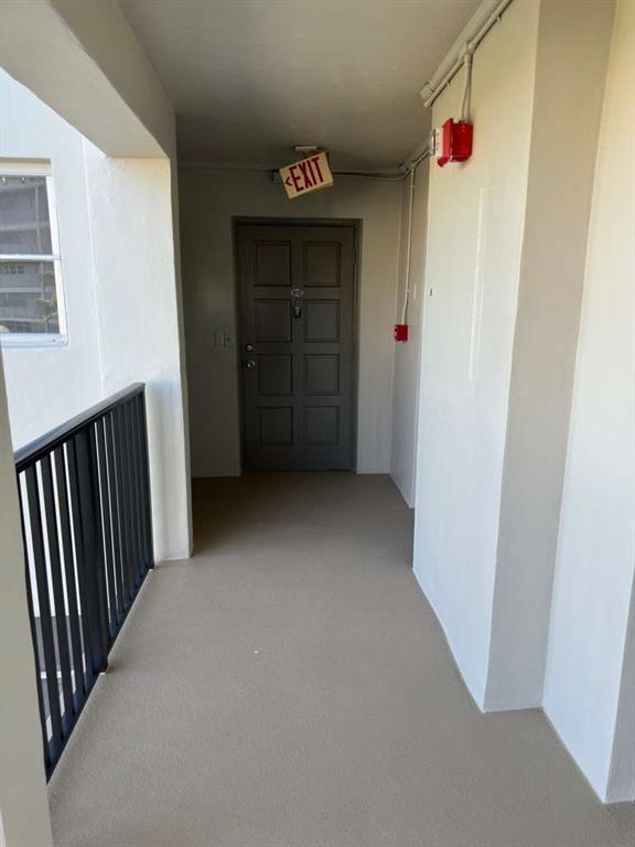 2681 South Course Drive, Unit 612 Pompano Beach, FL 33069 - Photo 2 of 27 a view of hallway with stairs