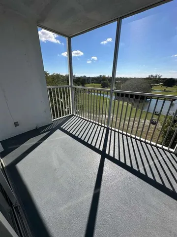 a view of balcony with furniture