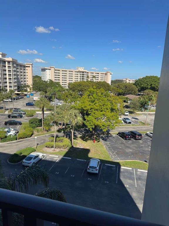 2681 South Course Drive, Unit 612 Pompano Beach, FL 33069 - Photo 26 of 27 a view of a swimming pool with an outdoor seating