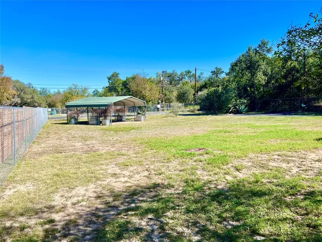 a backyard of a house with lots of green space